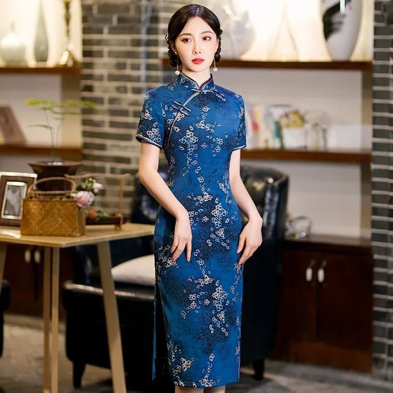 (002) 6a13f96b37fc14ccf02a5206d280fcaa Unveiling the Elegance of Blue Qipao: Tranquility, Harmony, and Wisdom